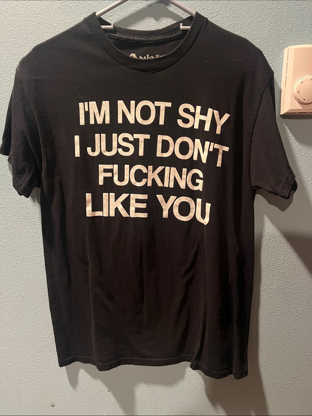 Black Graphic Crewneck Tee with Bold White Statement